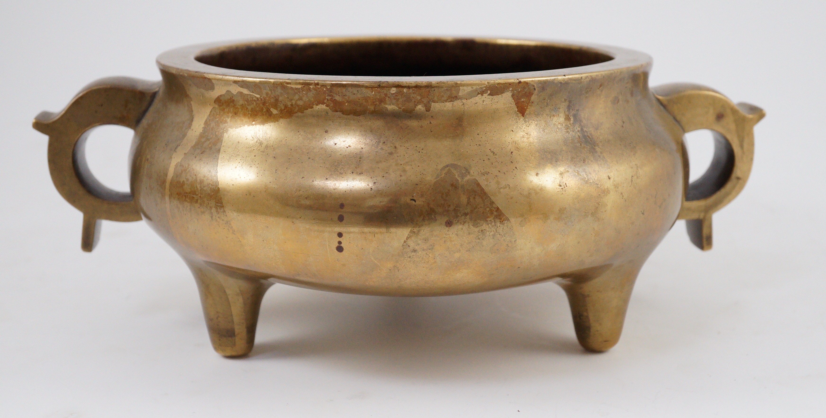 A large Chinese bronze censer, ding, 18th century, with sixteen character Xuande mark, 29cm wide